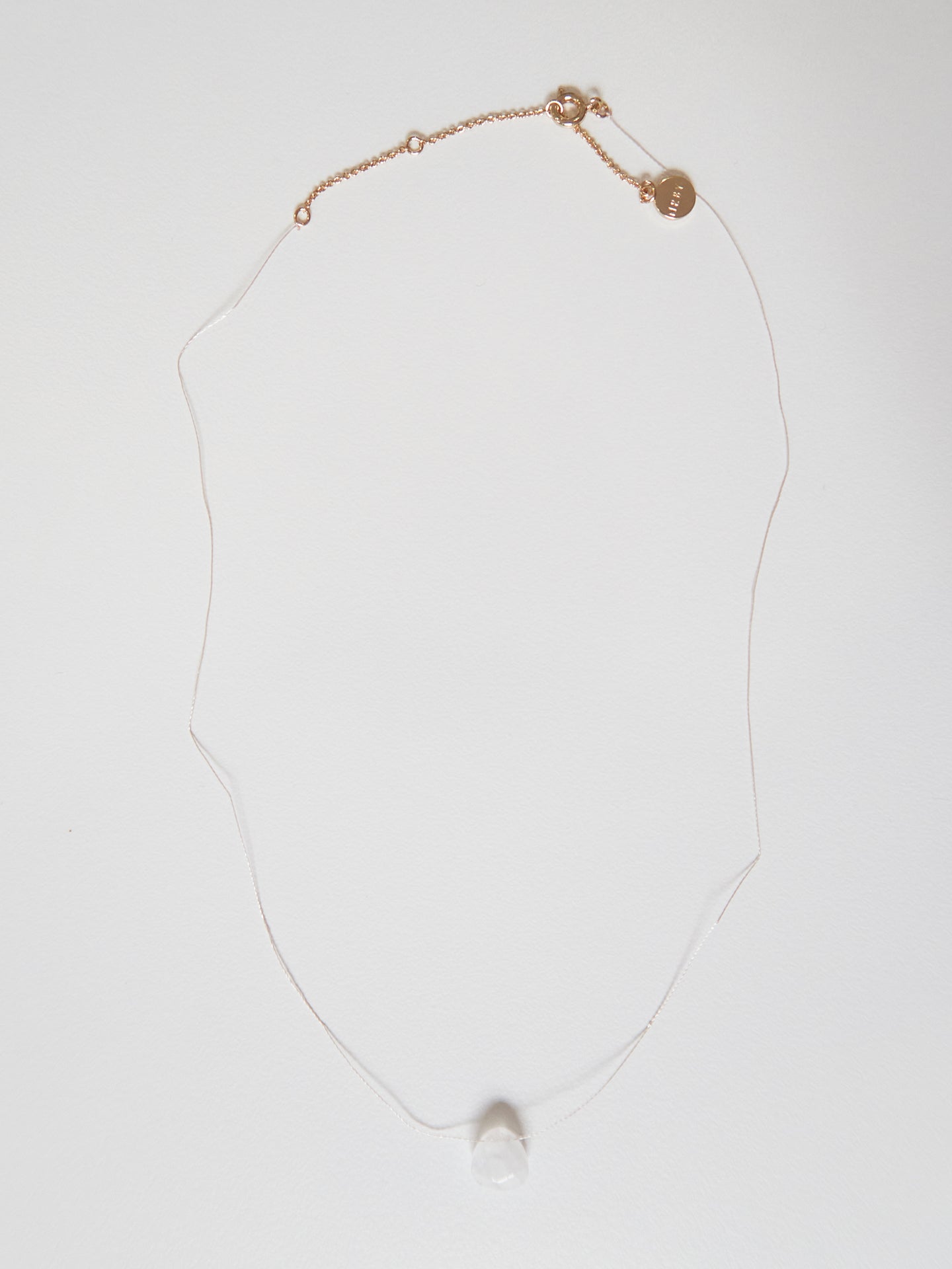 Silk thread necklace with clear quartz
