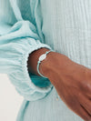 Silver bracelet with aqua tassel